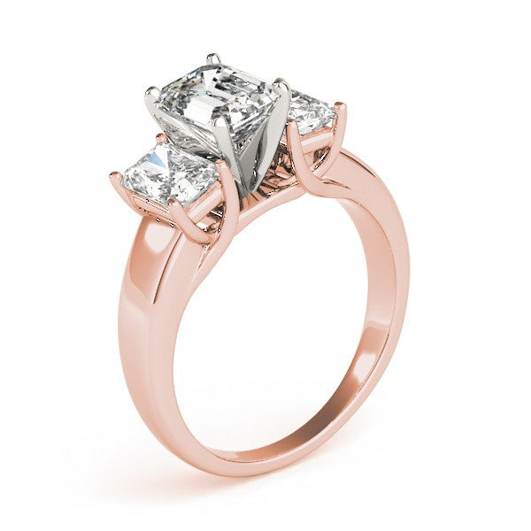 Rose gold ring with three diamond stones on a white background