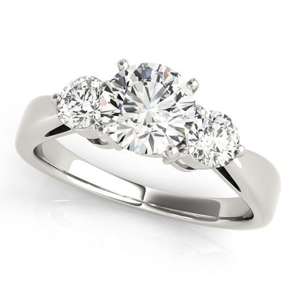 Three-stone diamond ring on a white background