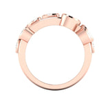 Rose gold ring with gemstones on a white background