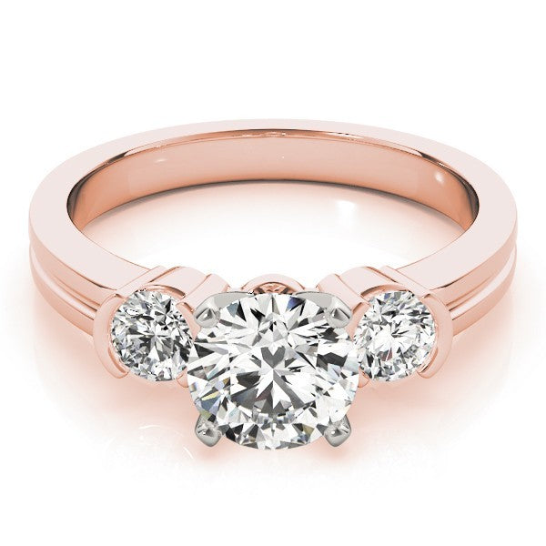 Rose gold ring with three diamond stones on a white background