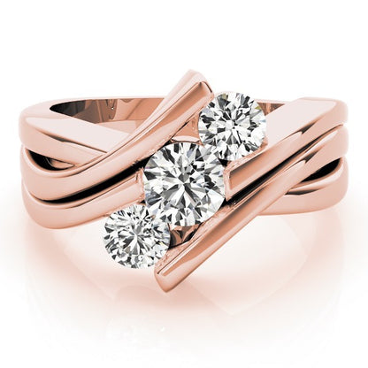 Rose gold ring with three diamonds on a white background