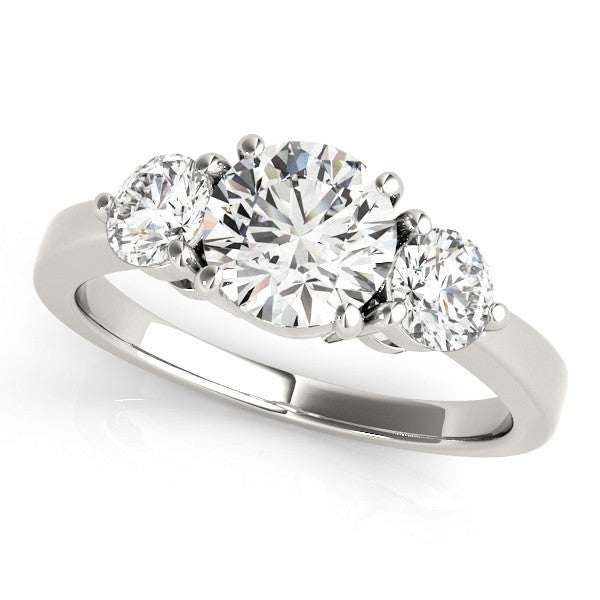 Three-stone diamond ring on a white background