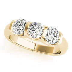 Gold ring with three diamonds on a white background