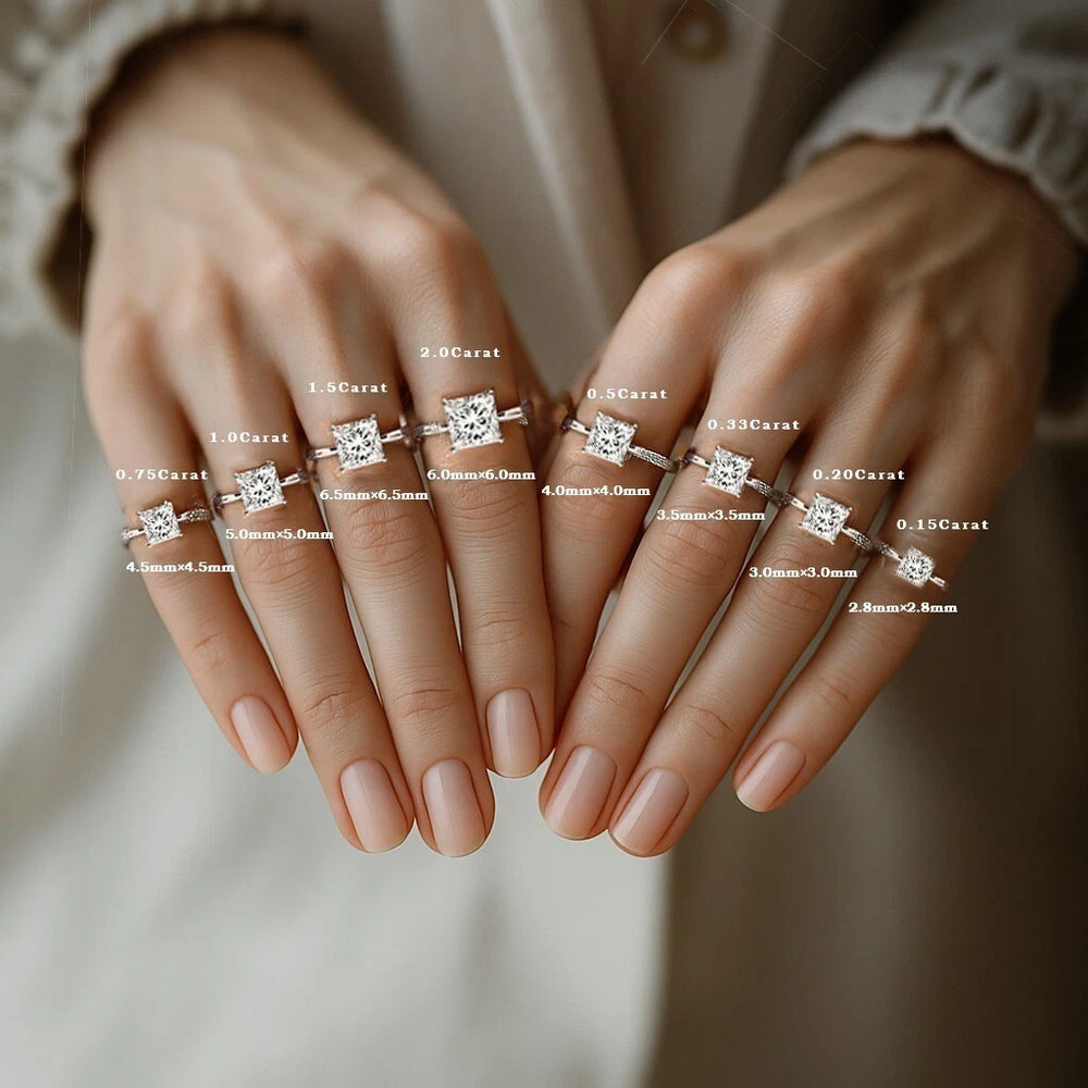 Set of diamond rings on fingers with carat weight labels
