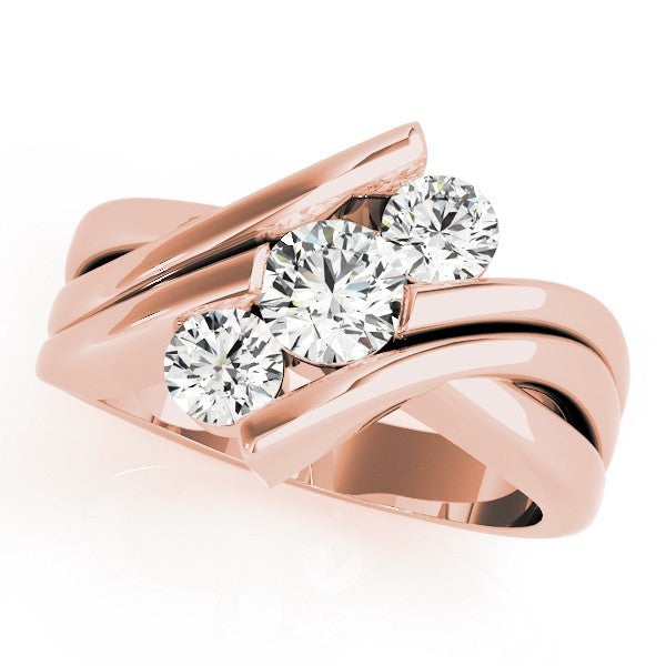 Rose gold ring with three diamonds on a white background