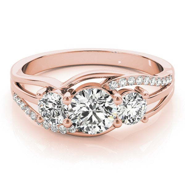 Rose gold ring with three diamonds on a white background