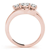 Rose gold ring with three diamonds on a white background
