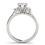 Diamond ring with three gemstones on a white background