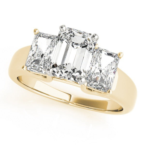 Gold ring with three emerald-cut diamonds on a white background