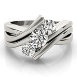 Silver ring with three diamonds on a white background