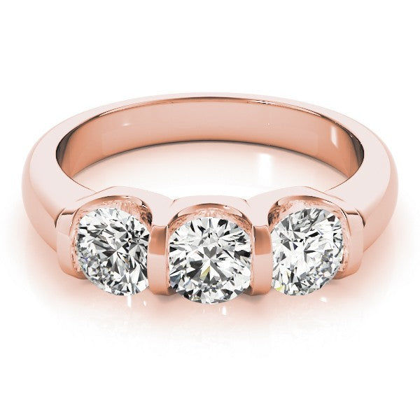 Rose gold ring with three diamonds on a white background