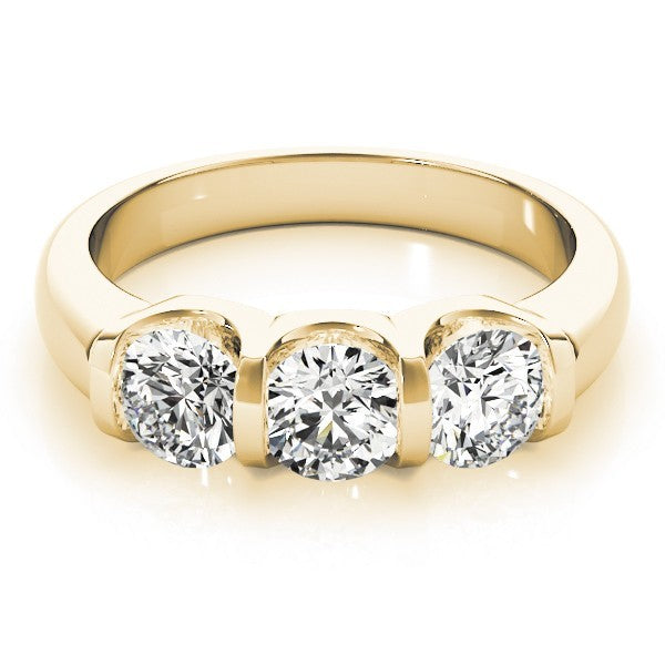 Gold ring with three diamonds on a white background