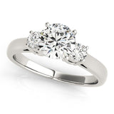 Diamond ring with three clear gemstones on a white background