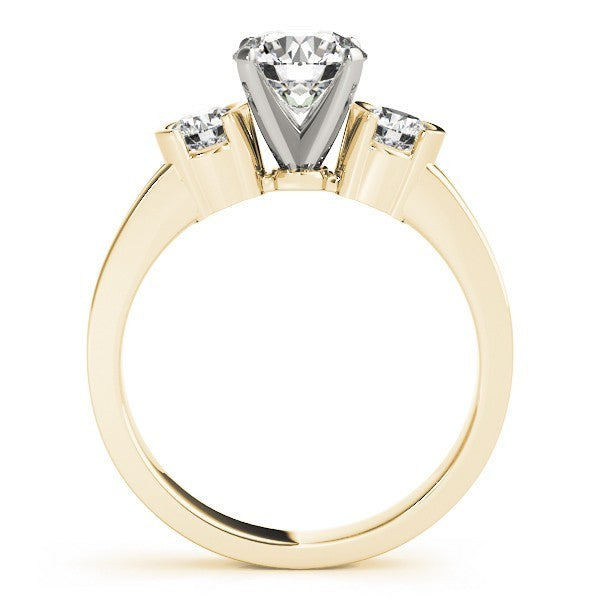 Gold ring with a central diamond and two smaller diamonds on a white background