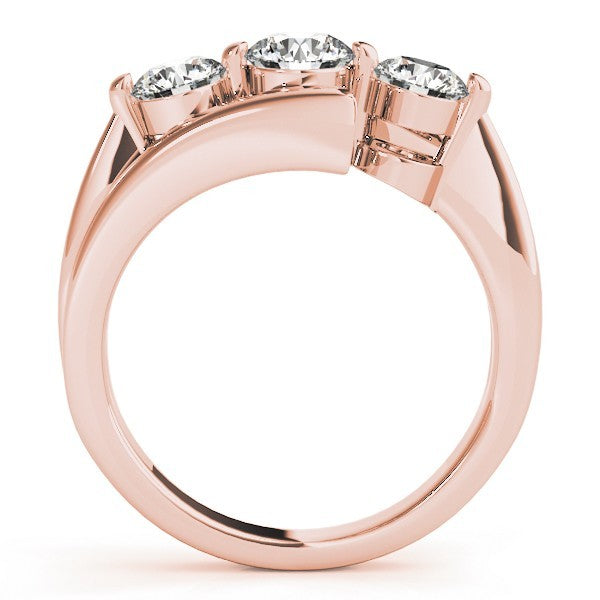 Rose gold ring with three diamonds on a white background