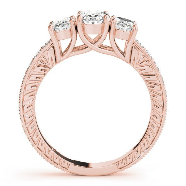 Rose gold ring with three diamonds on a white background
