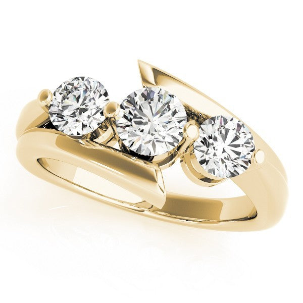 Gold ring with three diamonds on a white background