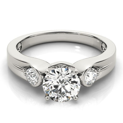 Silver ring with a central diamond and two smaller diamonds on a white background