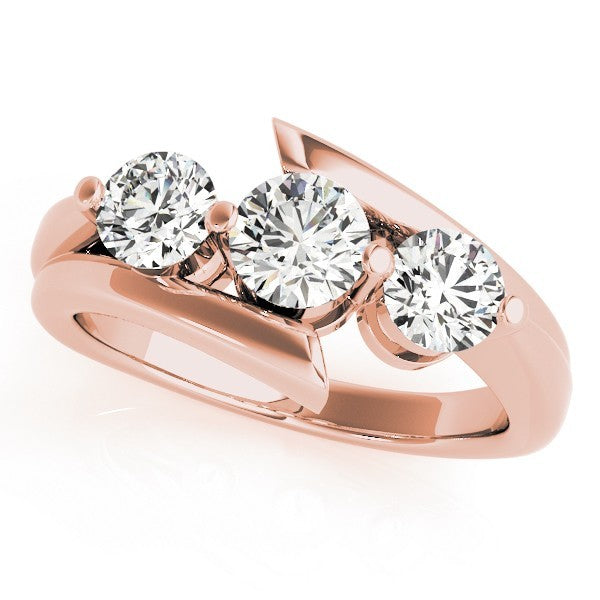 Rose gold ring with three diamonds on a white background
