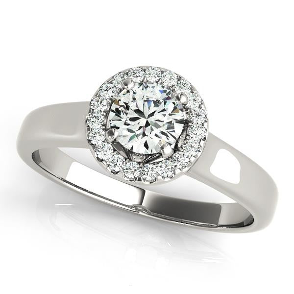Elegant round cut diamond halo engagement ring in platinum setting.