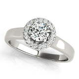 Elegant round cut diamond halo engagement ring in platinum setting.