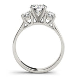 Diamond ring with three clear gemstones on a white background