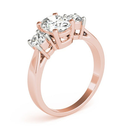 Rose gold ring with three diamonds on a white background