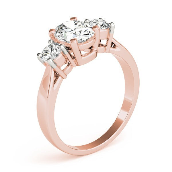 Rose gold ring with three diamonds on a white background