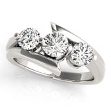 Silver ring with three diamonds on a white background