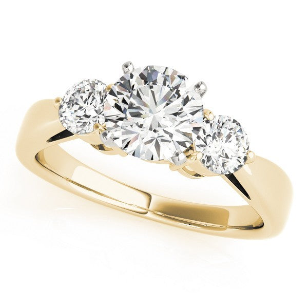 Gold ring with three diamonds on a white background