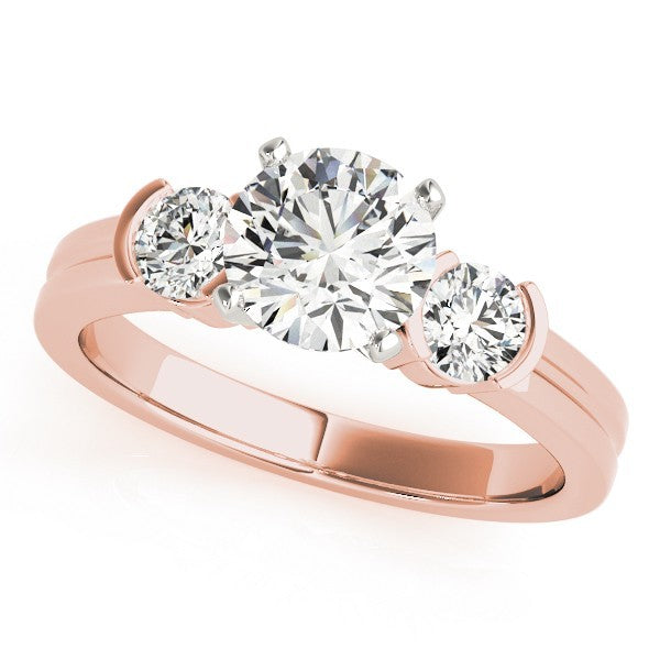 Rose gold ring with three diamonds on a white background