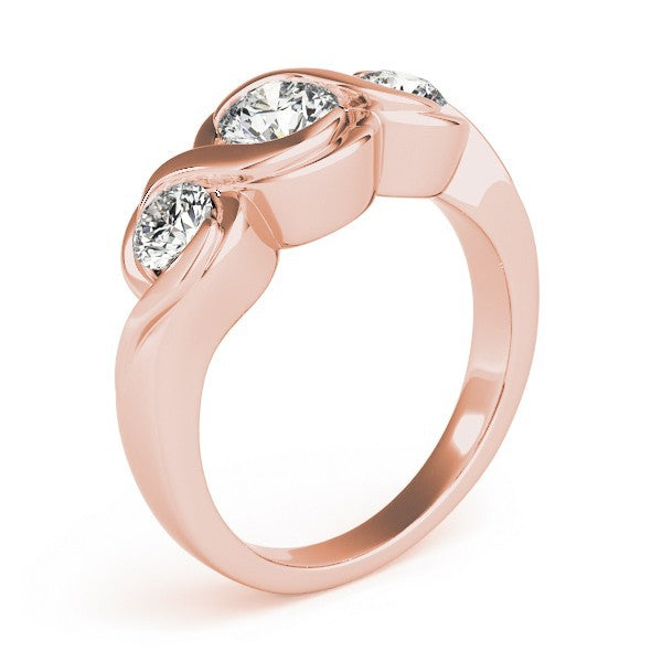 Rose gold ring with three clear gemstones on a white background