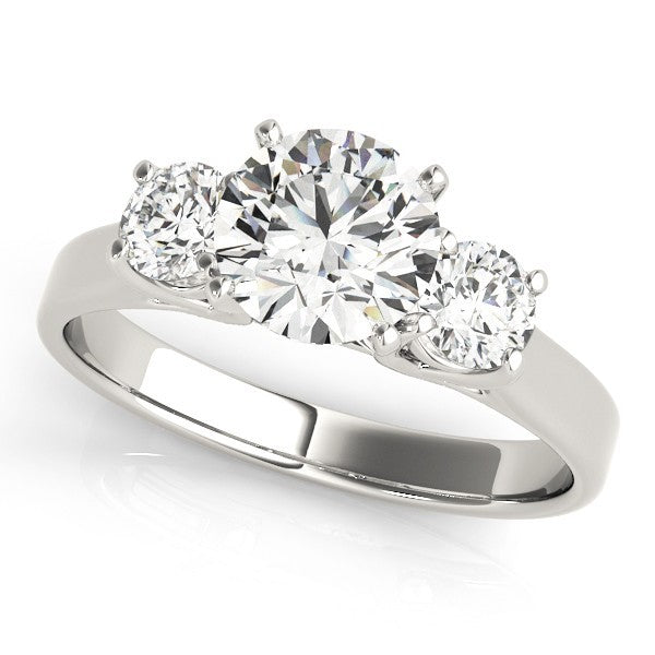 Three-stone diamond ring on a white background