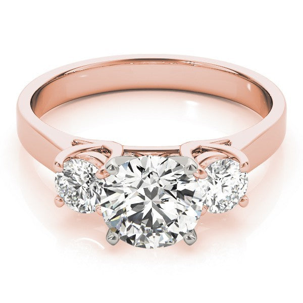 Rose gold ring with three diamonds on a white background