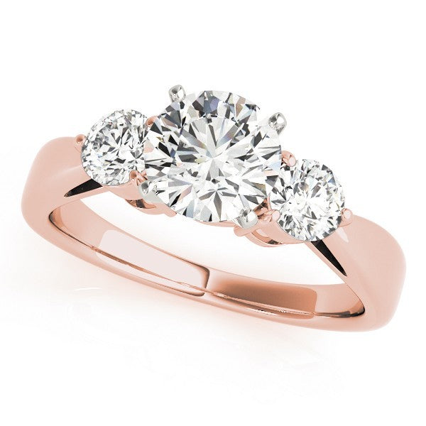 Rose gold ring with three diamonds on a white background