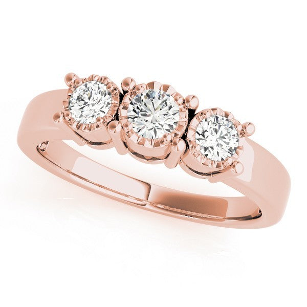 Rose gold ring with three diamonds on a white background