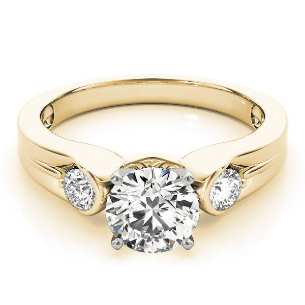 Gold ring with a central diamond and two smaller diamonds on a white background
