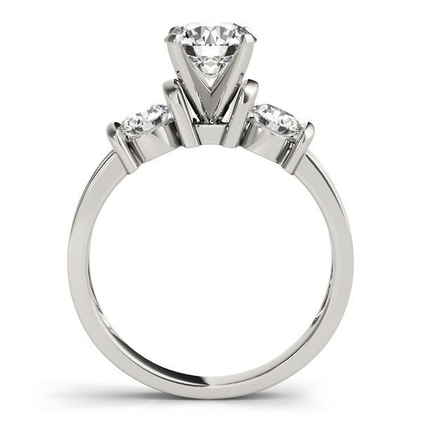 Diamond ring with a central stone flanked by two smaller stones on a white background