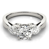 Silver ring with three diamonds on a white background