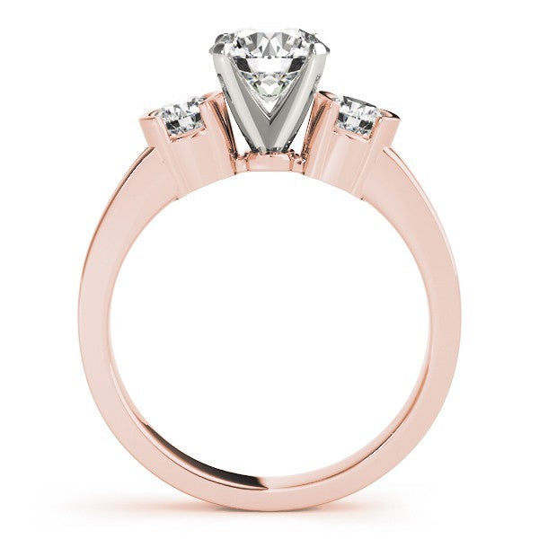 Rose gold ring with a central diamond and two smaller diamonds on a white background