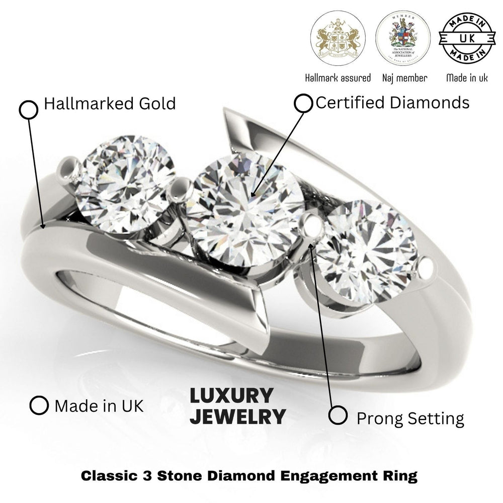 Three-stone diamond engagement ring with hallmarking details on a white background