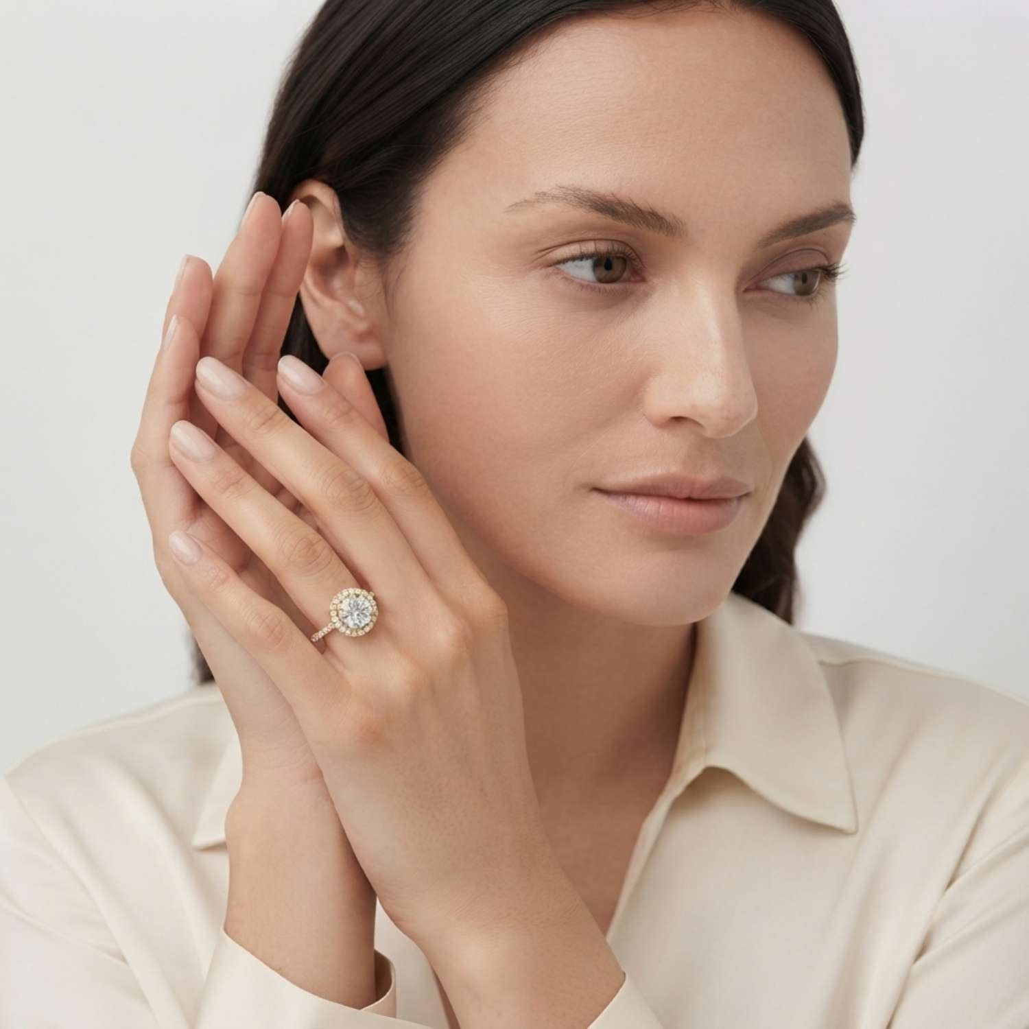 Secure four-prong setting holding a brilliant round lab-grown diamond with sparkling shoulders.