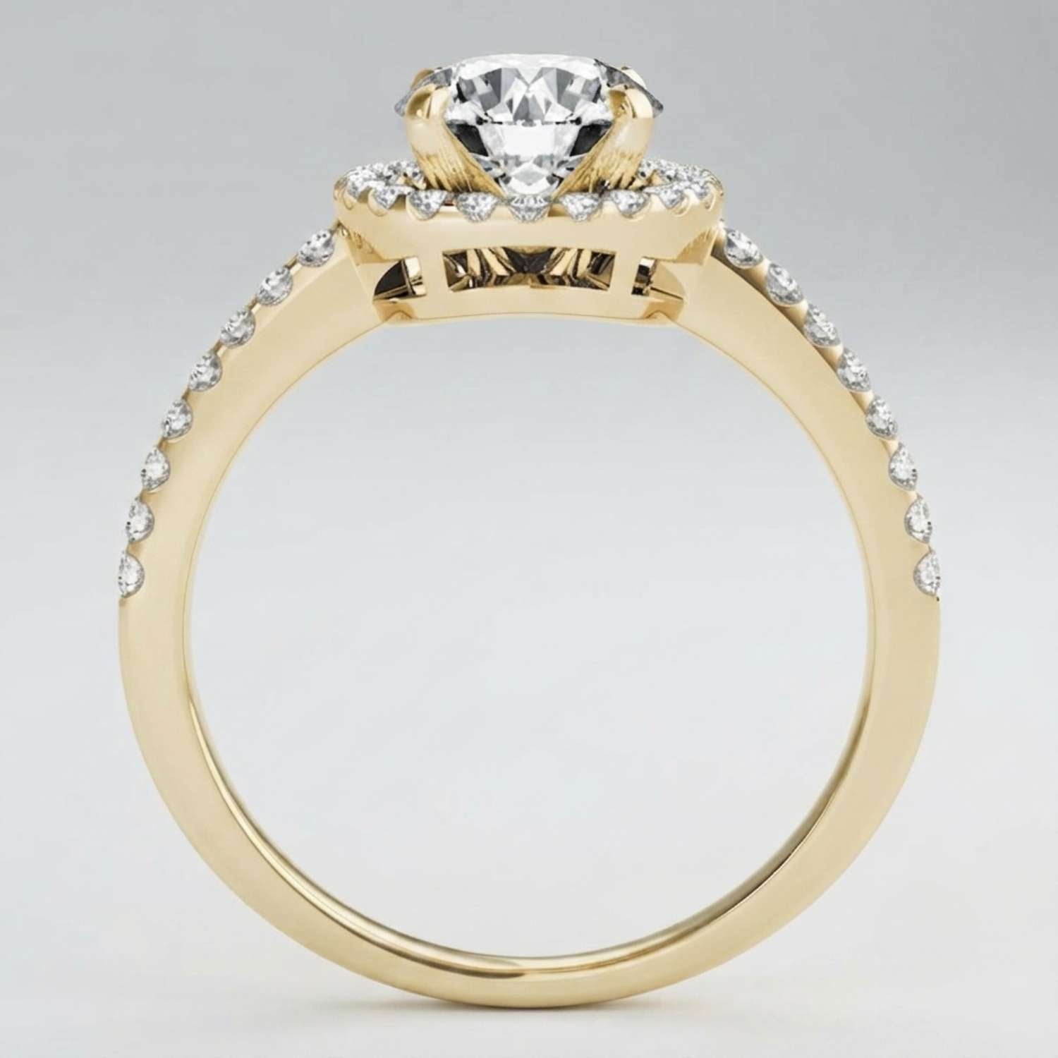 Secure four-prong setting holding a brilliant round lab-grown diamond with sparkling shoulders.