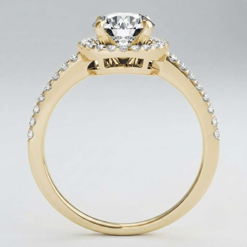 Secure four-prong setting holding a brilliant round lab-grown diamond with sparkling shoulders.