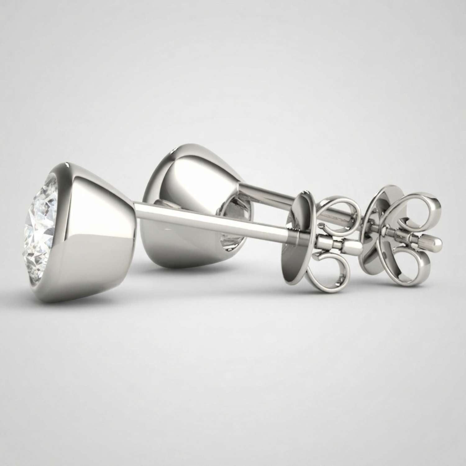 Sustainable lab-grown diamond bezel-set studs highlighting exceptional brilliance and fire.