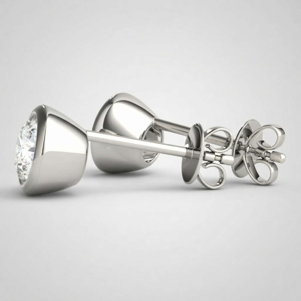Sustainable lab-grown diamond bezel-set studs highlighting exceptional brilliance and fire.