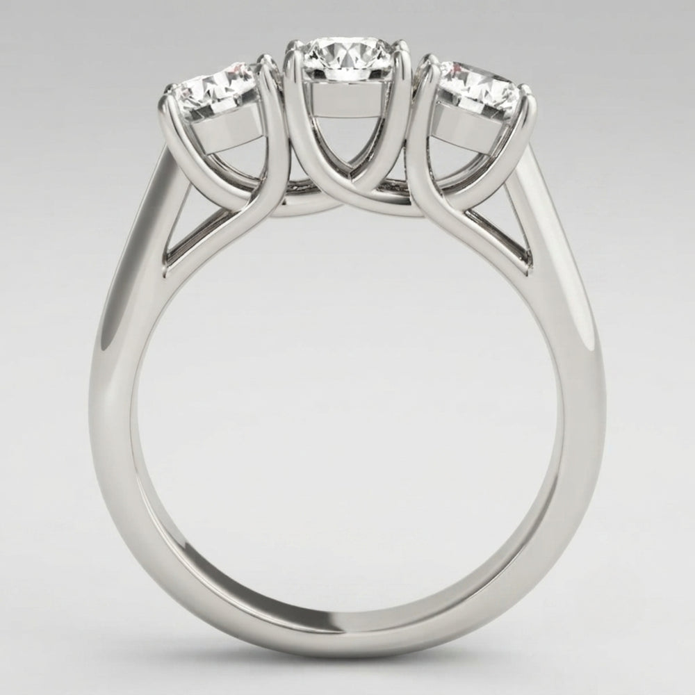 Timeless round-cut lab-grown diamond trilogy engagement ring with a high-polished finish and ethical luxury appeal.
