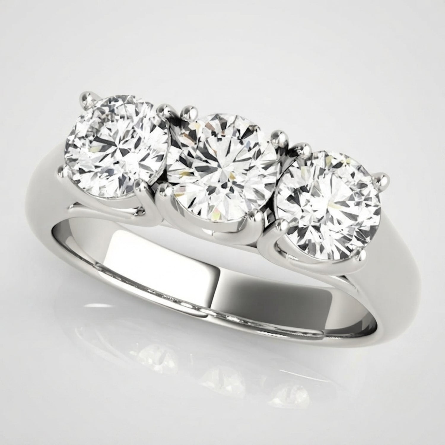 Timeless round-cut lab-grown diamond trilogy engagement ring with a high-polished finish and ethical luxury appeal.