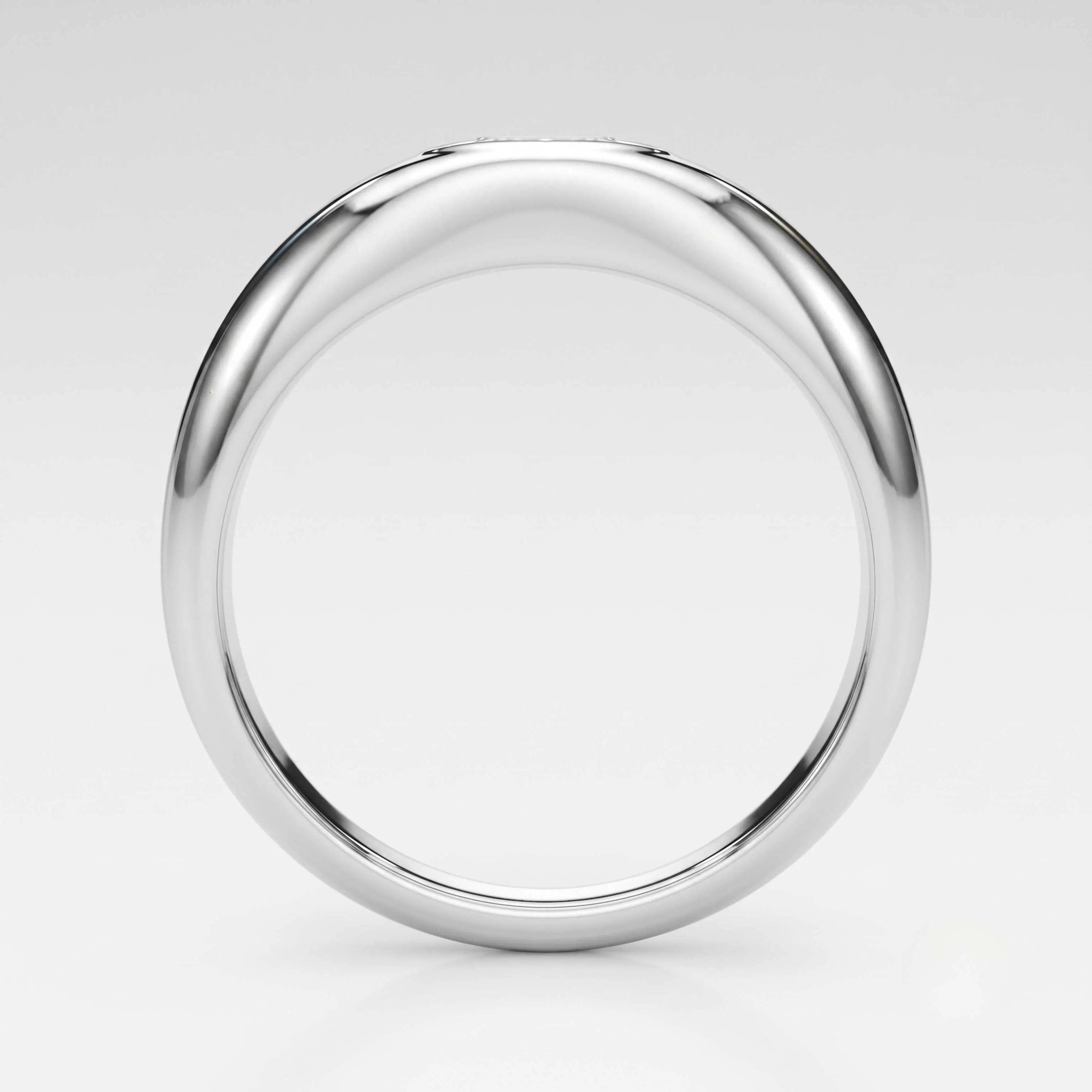 A polished white-gold metal ring with a smooth, rounded profile, shown from a top-down perspective on a light gray background.
