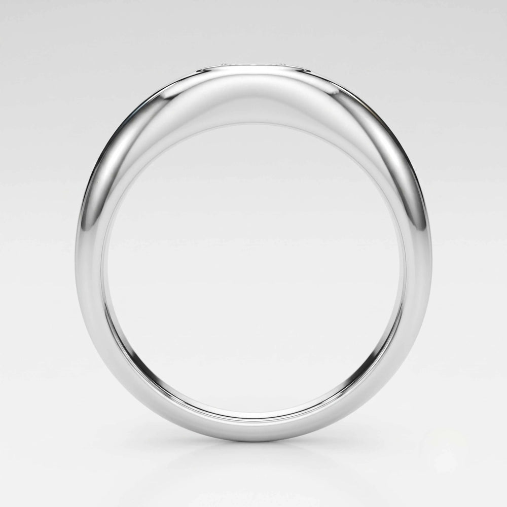 A polished white-gold metal ring with a smooth, rounded profile, shown from a top-down perspective on a light gray background.